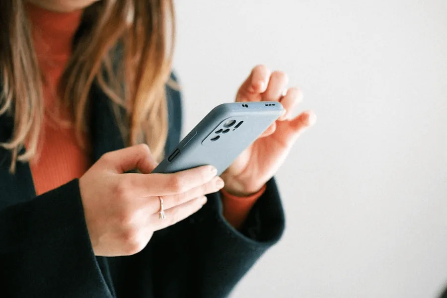 Woman checking meal plan on her phone